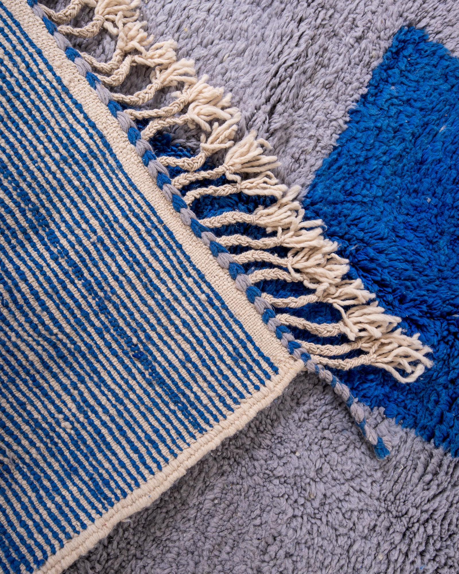 Modern, designer, handcrafted Berber rug from Morocco. Beniourain carpet with beautiful colours and patterns and fluffy wool texture.